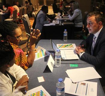 An EIFL partner publisher speaks with EIFL Country Coordinators from Ghana and Kenya at the EIFL General Assembly. An EIFL partner publisher meets EIFL country coordinators from Ghana and Kenya at the EIFL General Assembly.