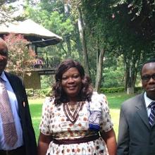Three people - Lucy Dzandu, Simon Osei and Benjamin Folitse from the Ghana CSIR-INSTI institutional repository implementation team - standing in a garden in Addis Ababa. 