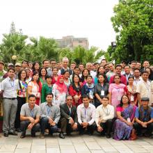 Group photo of seminar participants in the grounds of Hotel Shanker