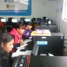 Young mothers studying on the library's computers.