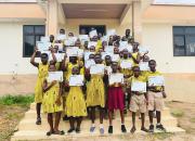 Students at Volta Regional Library holding up their certificates. 