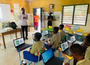 Ghanaian schoolchildren learning to use computers in a school classroom. 