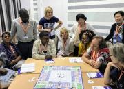 IFL guest blogger Jane Secker, standing, second from left, plays The Publishing Trap with EIFL General Assembly delegates. 