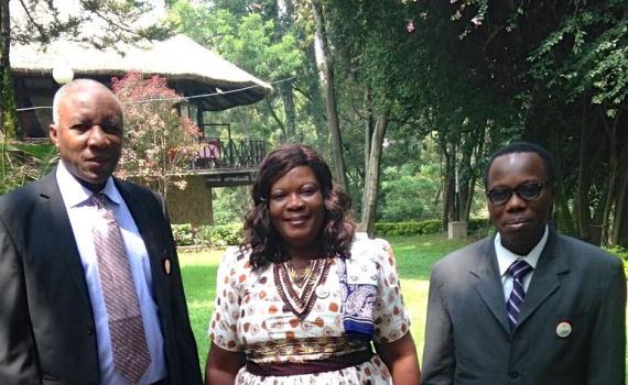 Three people - Lucy Dzandu, Simon Osei and Benjamin Folitse from the Ghana CSIR-INSTI institutional repository implementation team - standing in a garden in Addis Ababa. 