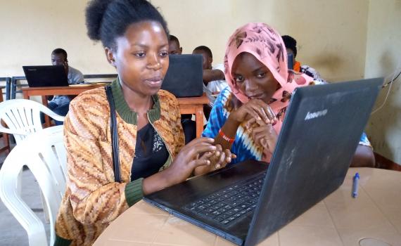 two young women learning ICT during Maendeleo Foundation workshop.