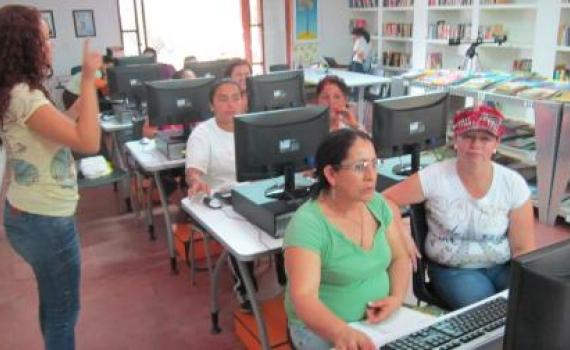 Women farmers at a computer class in the library.