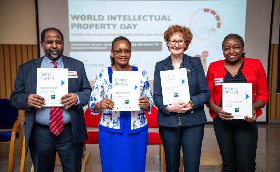 Teresa Hackett (EIFL) and colleagues holding copies of the Kenyan edition of ‘Getting Started. Implementing the Marrakesh Treaty for persons with print disabilities’ during the launch ceremony.